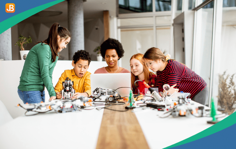 Children collaborate to build a robot, emphasizing teamwork and communication