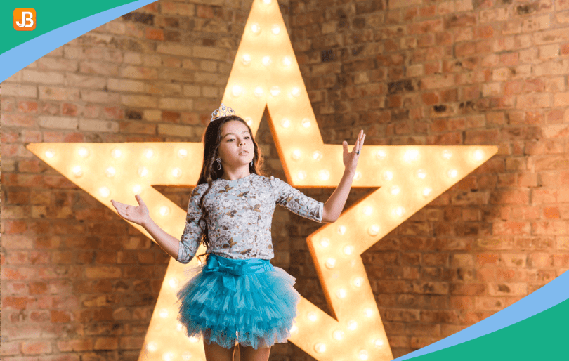  A camper performing on stage during a talent show