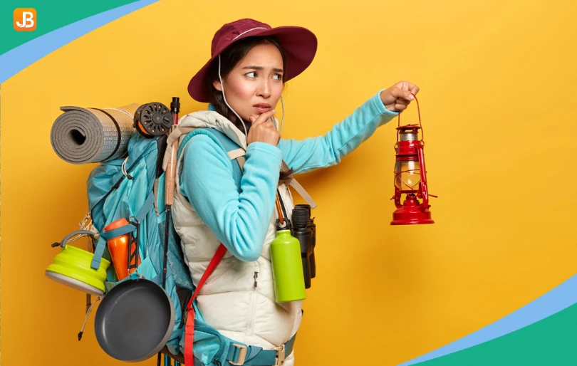 A woman thoughtfully considering camp safety measures.