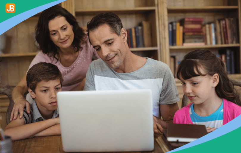 Parents and students look at a laptop together and are engaged in content