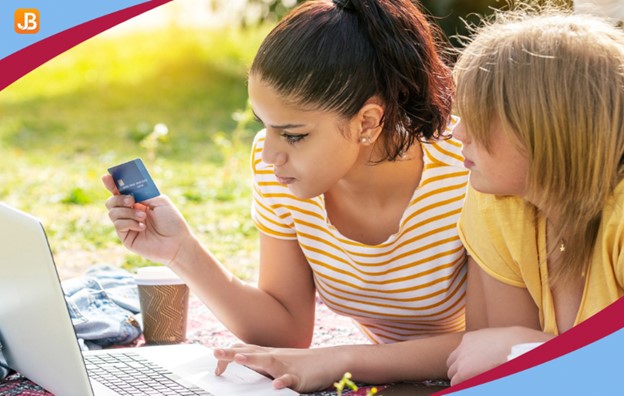 A woman making an online payment on her laptop, representing the convenience of Online Payments for Childcare Centers.